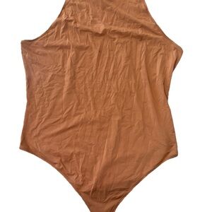 Pink cotton snap bodysuit in tan/caramel brown soft stretch tank